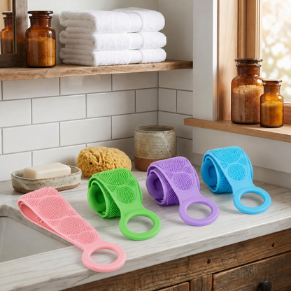 Four-color silicone body scrubber belts on a bathroom counter